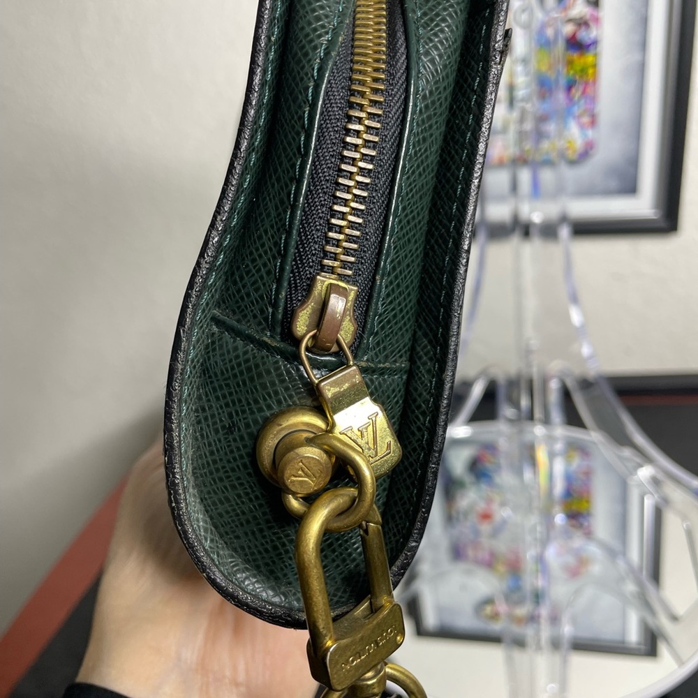 LV taiga leather clutch bag